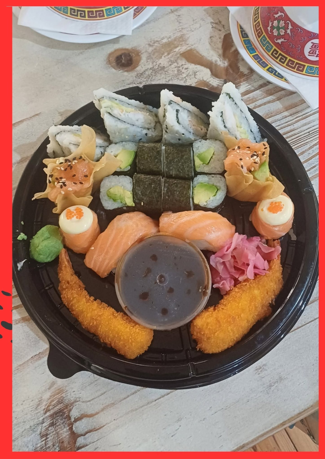 Golden Bowl sushi platter with fashion sandwiches, maki, salmon nigiri and crumbed prawns